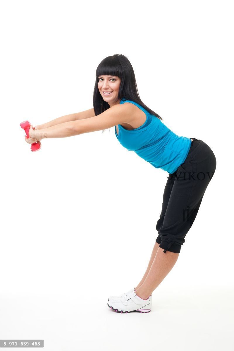 Woman stretching with dumbbells