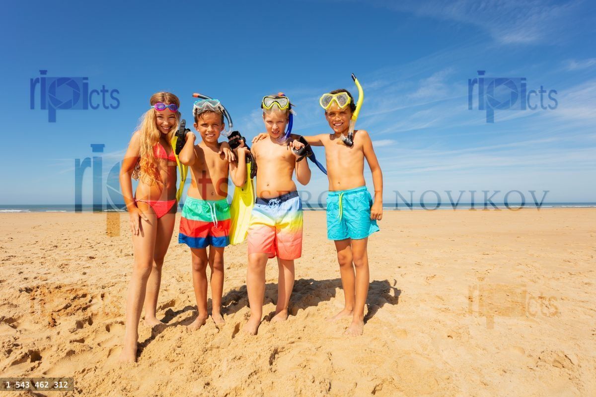 Friends group on the beach with snorkeling tools