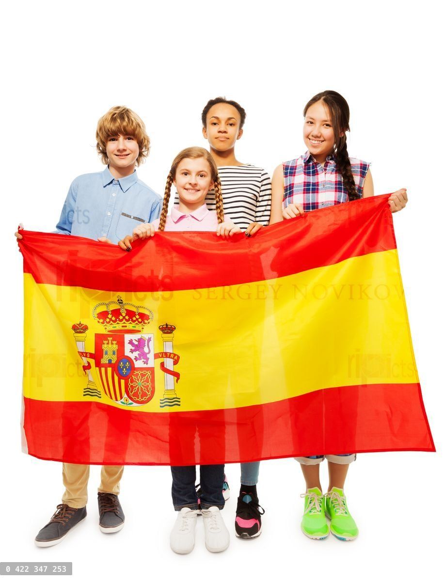 Four multiethnic teenage kids holding Spanish flag