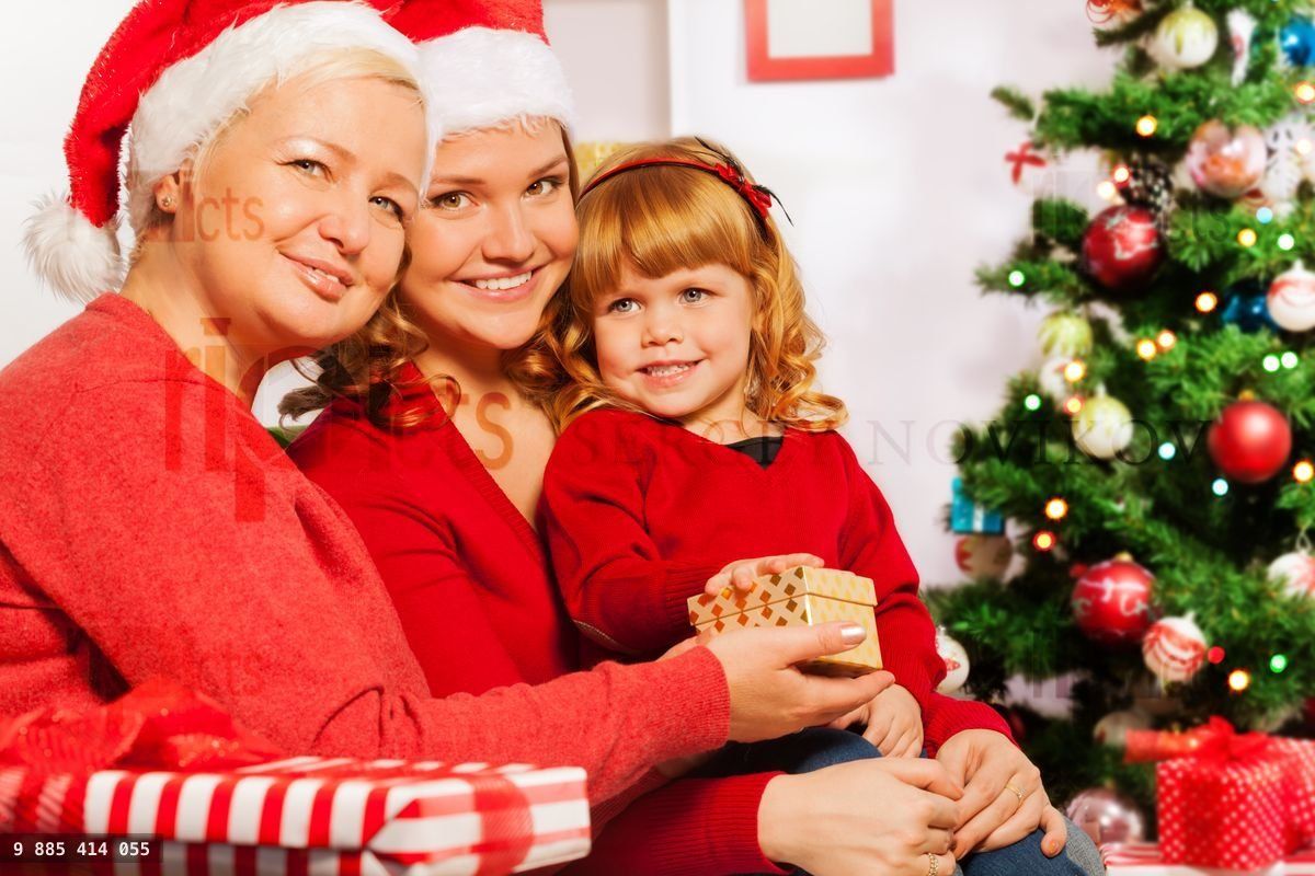 Granny and mother give presents to 3 years girl