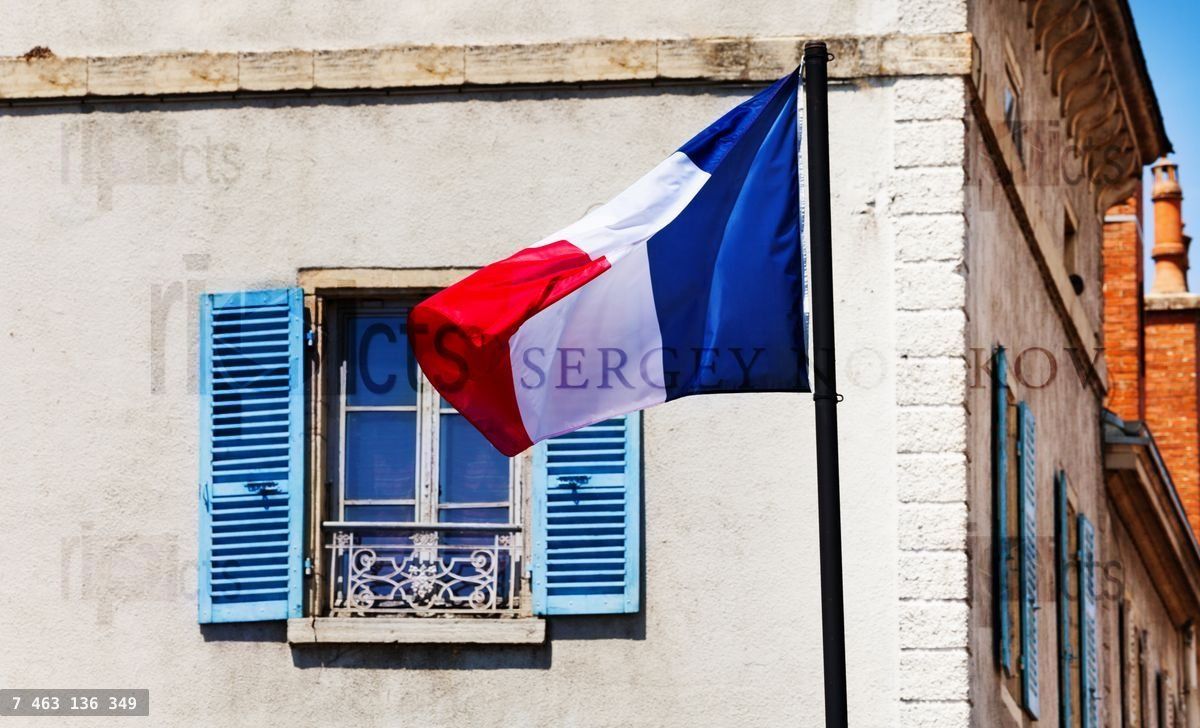 French flag over classical generic France window