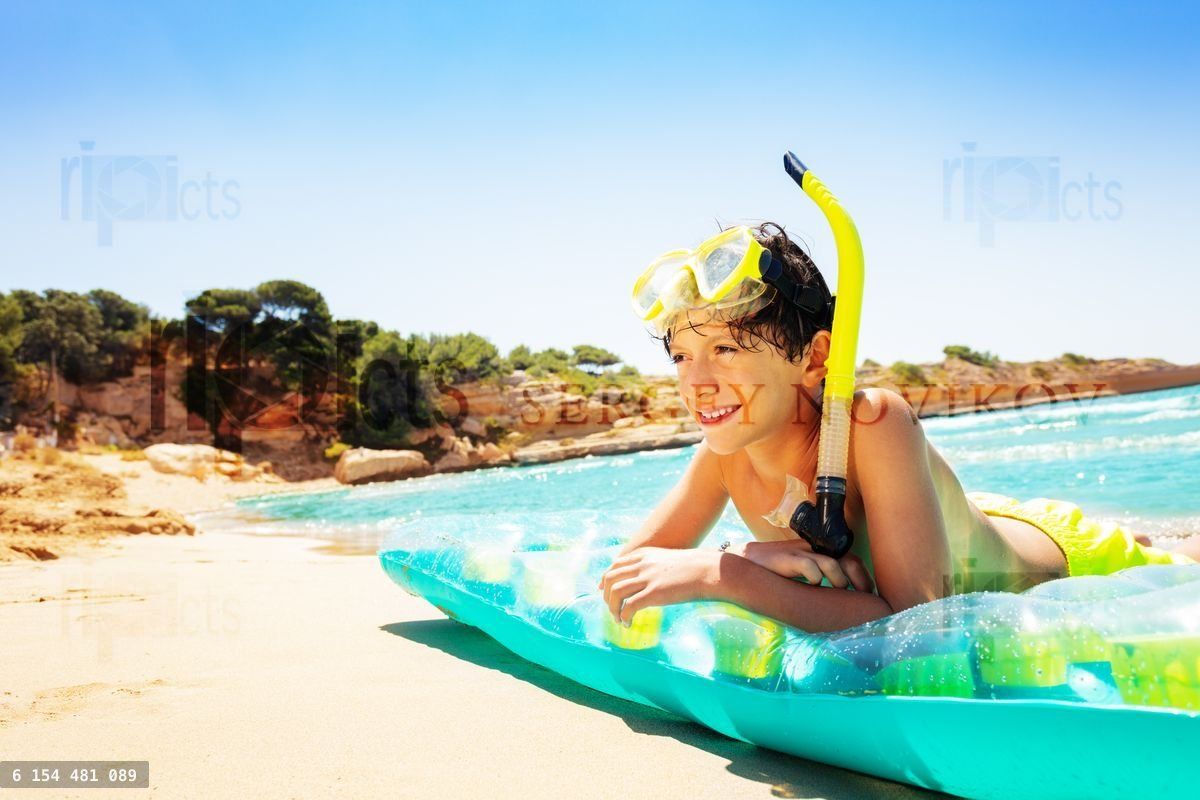 Young diver spending summer vacation on the beach