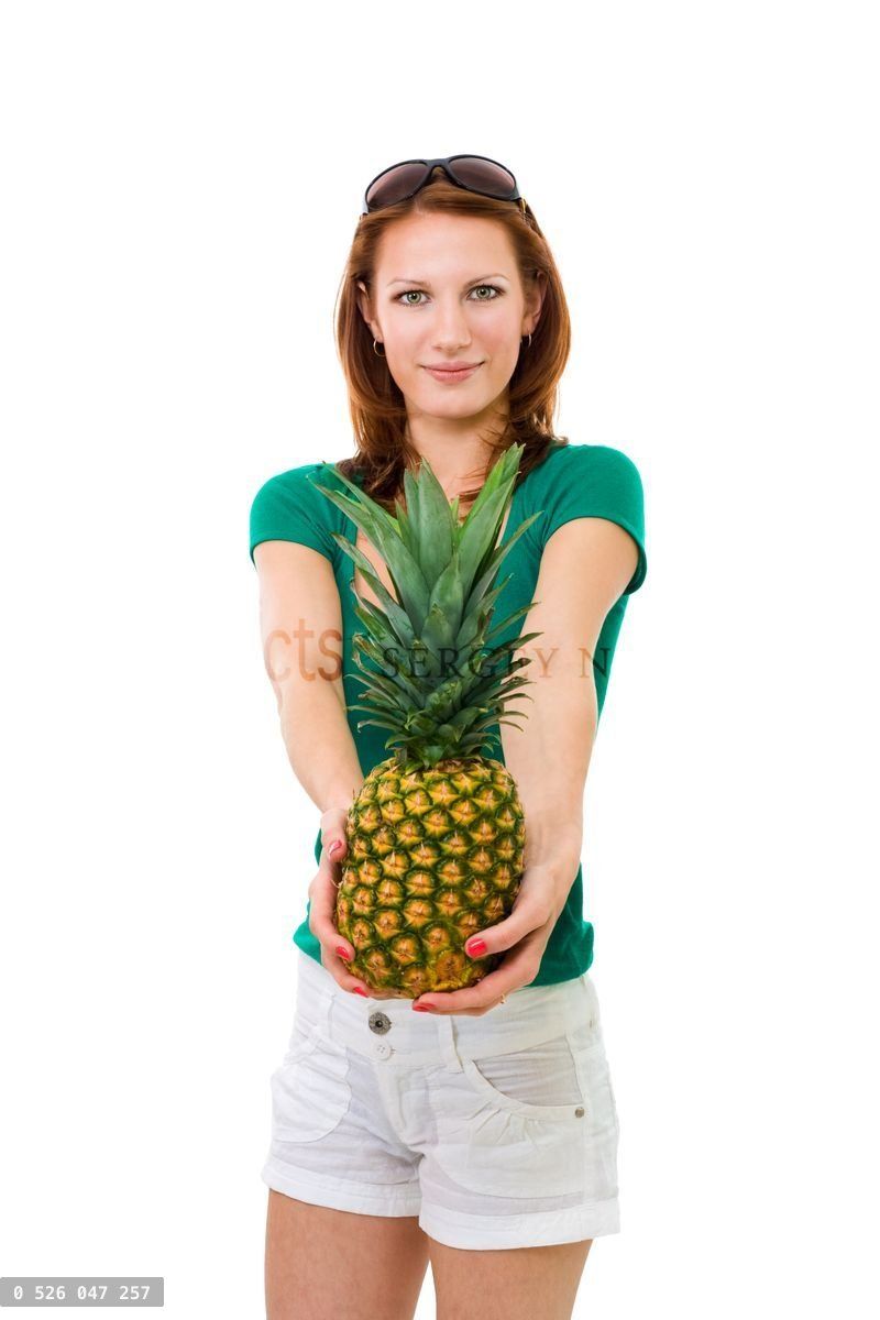 woman offering pineapple