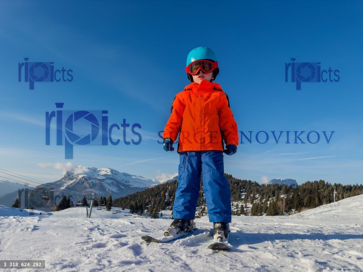 Young skier, ready to conquer sunny French mountain slopes
