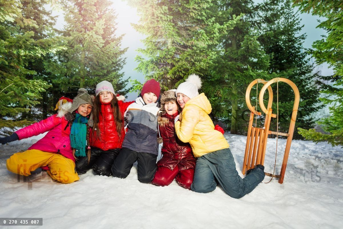 Friends in winter wear having happy time outside