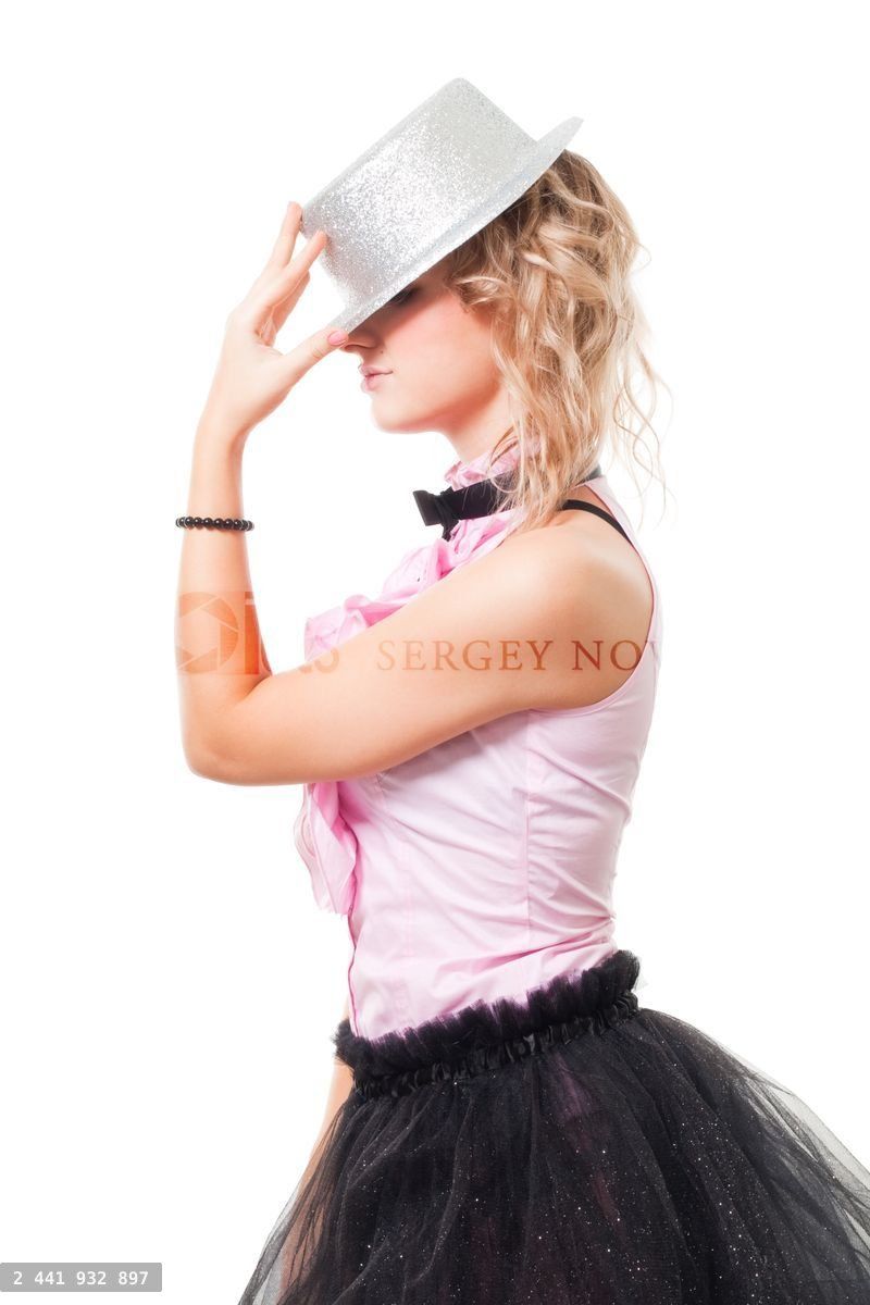 Woman illusionist with magician hat