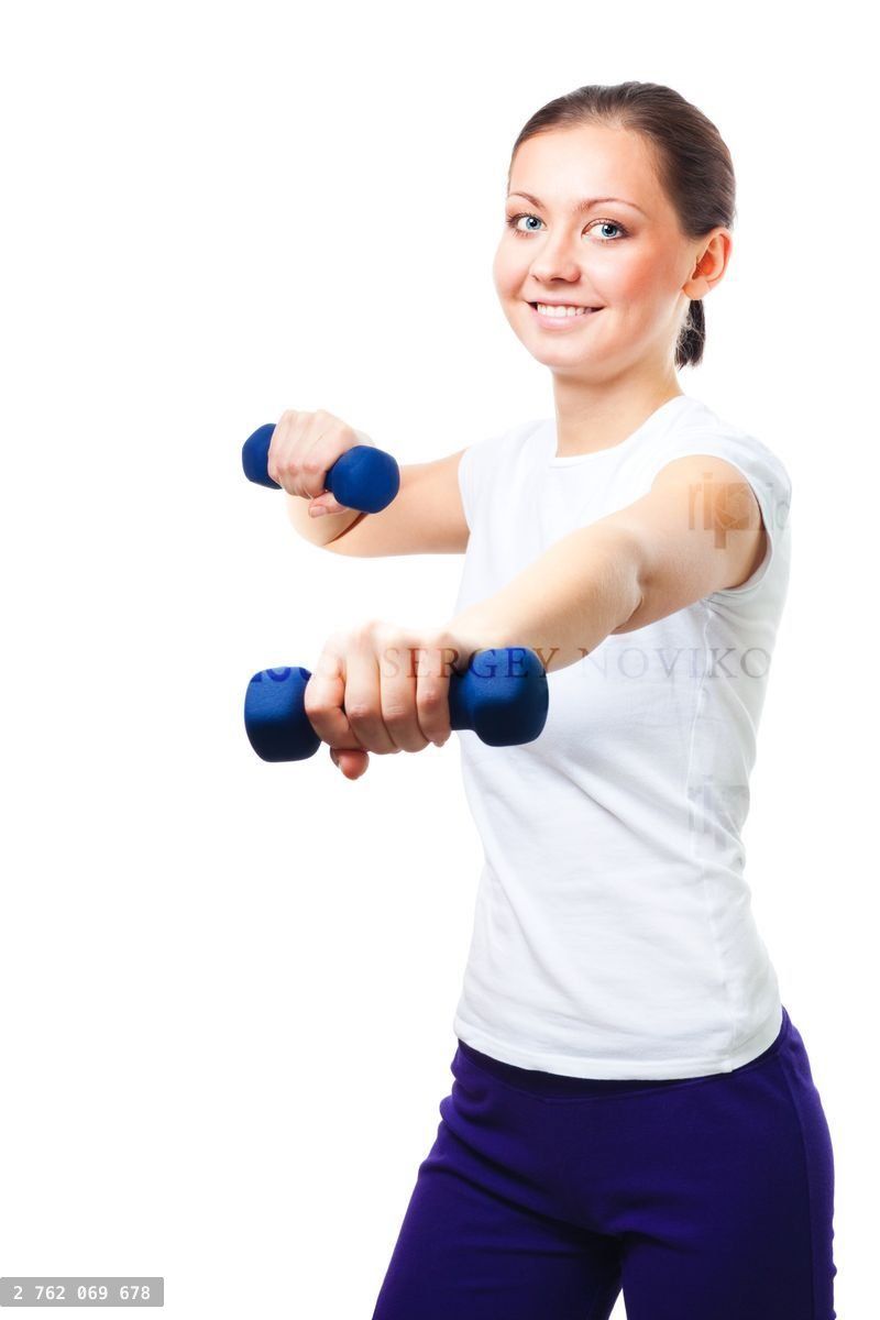 woman exercises with dumbbells