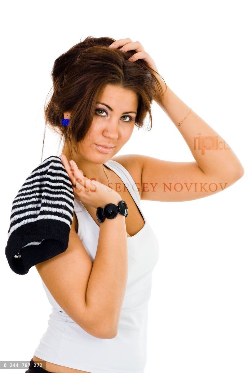Woman with striped hat holding her hair