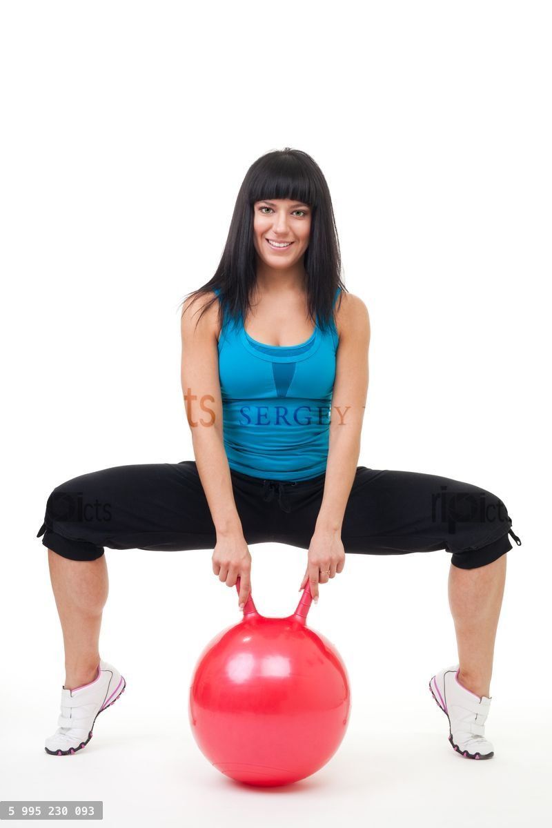 Young happy woman exercise with sport ball