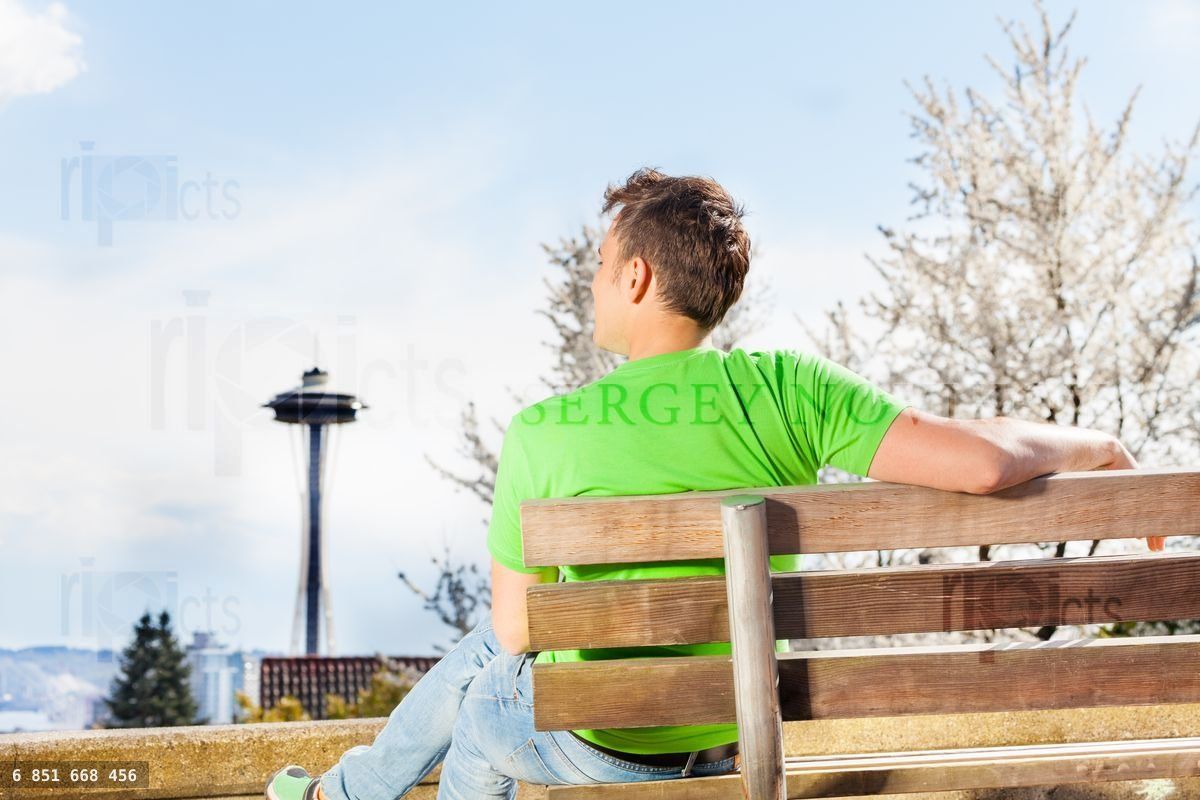 Young man with Seattle space needle on background