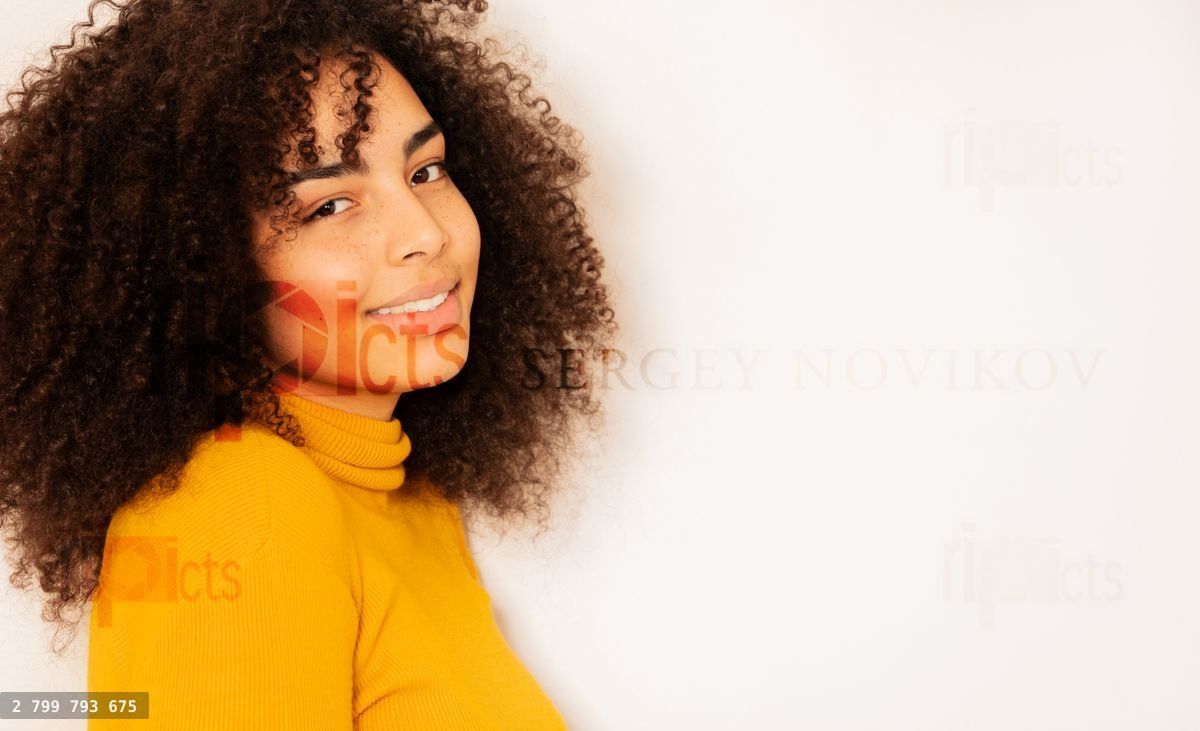 Young woman with beautiful smile and curly hair