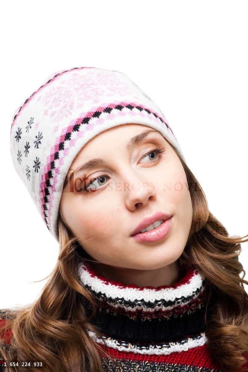 Woman in winter cap interested