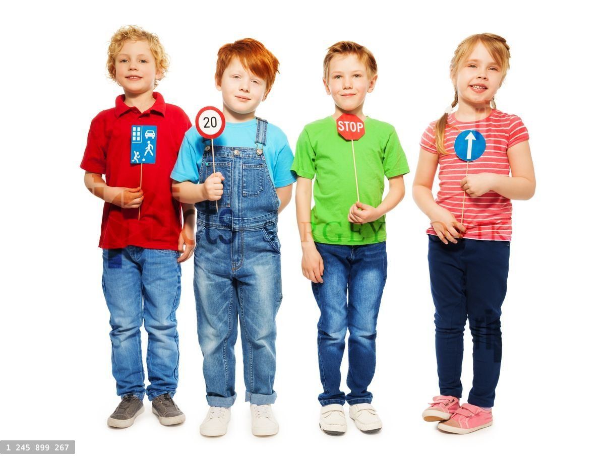 Four happy kids studying safety of traffic rules