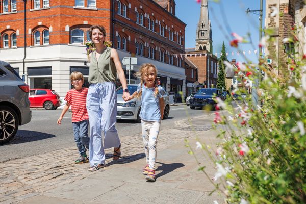 Kids and parent happily walking do sightseeing in United Kingdom