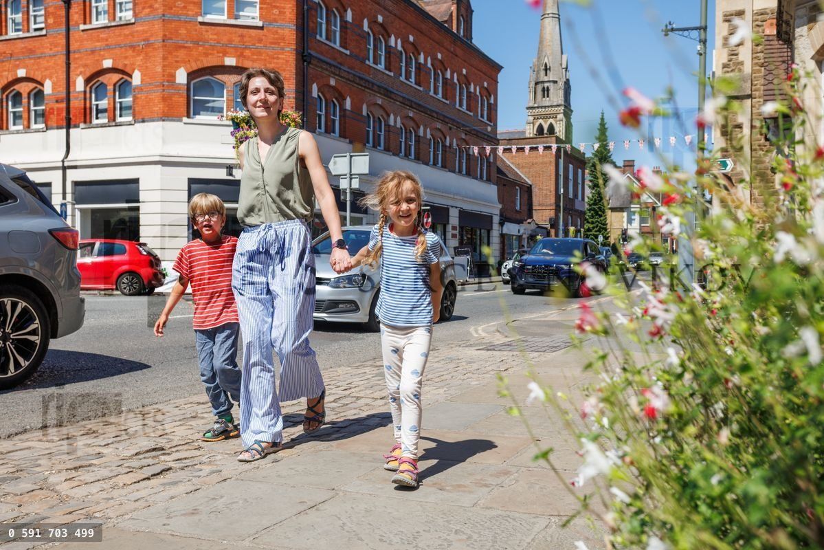 Kids and parent happily walking do sightseeing in United Kingdom