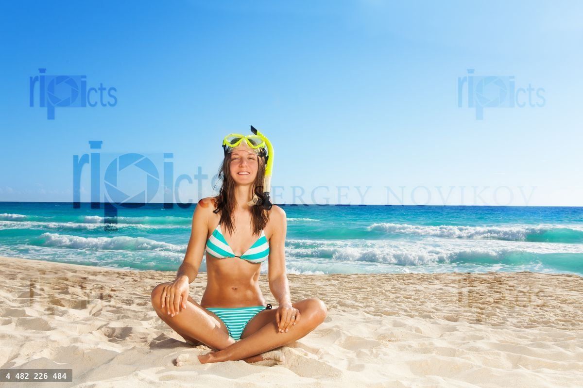 Young woman resting after scuba diving