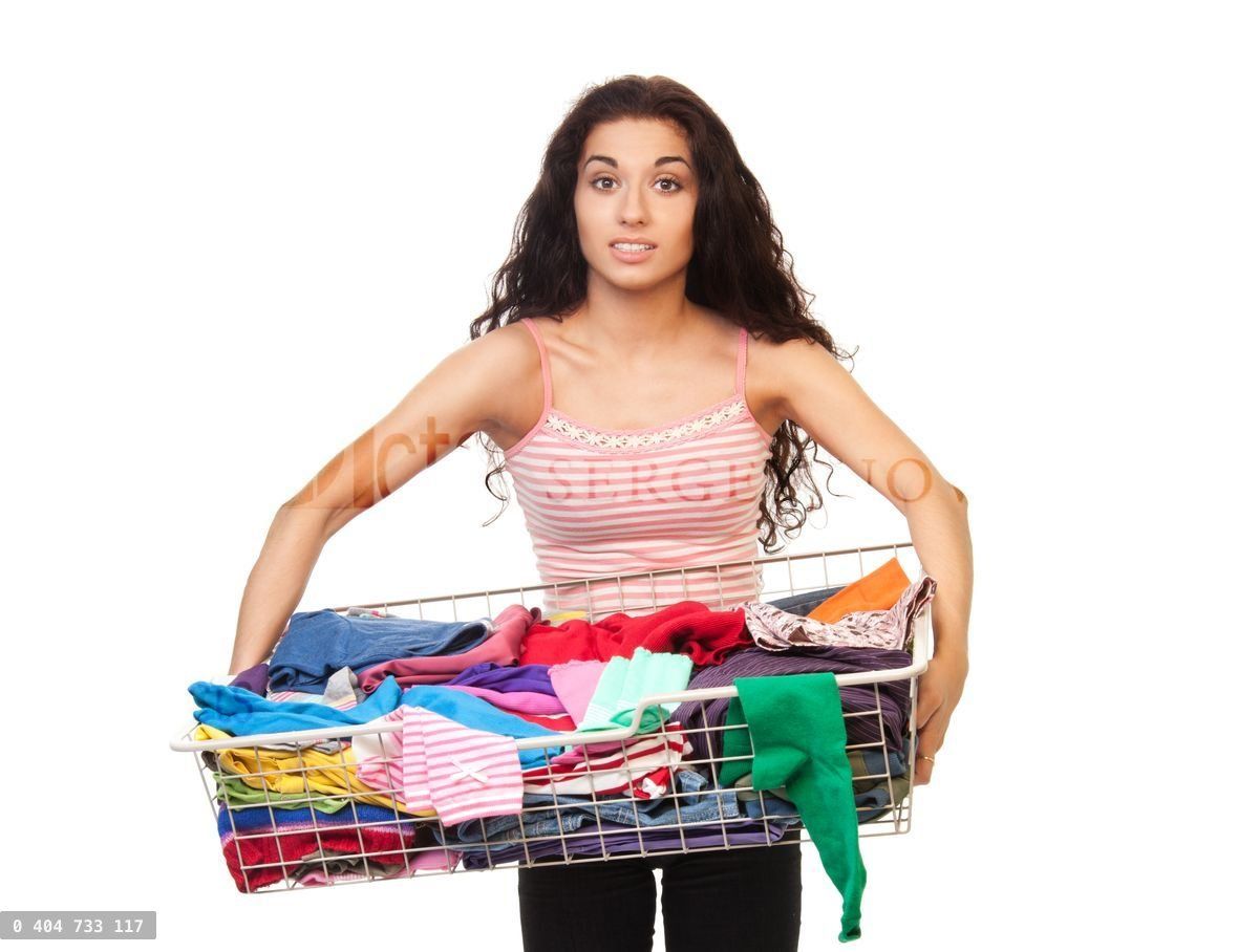 Woman holding basket of clothes