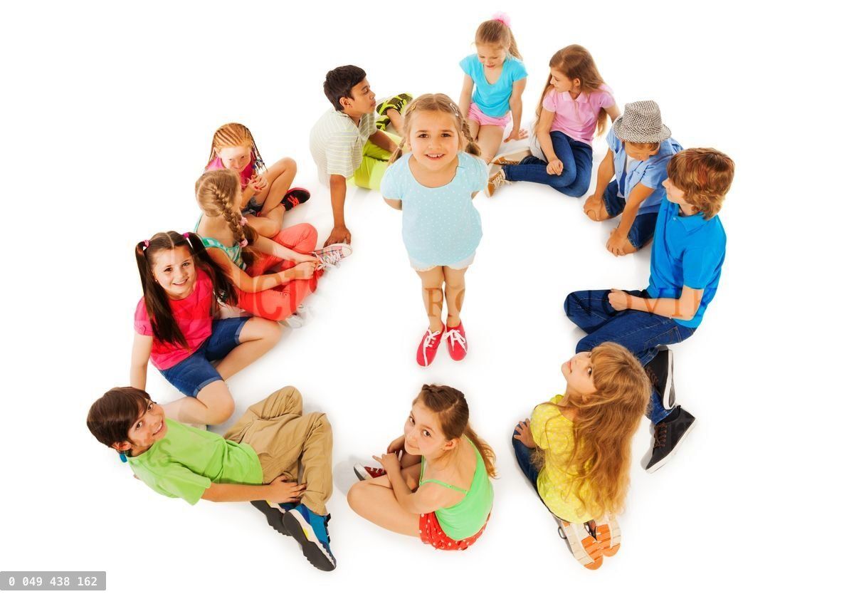 Little girl in circle of friends from above