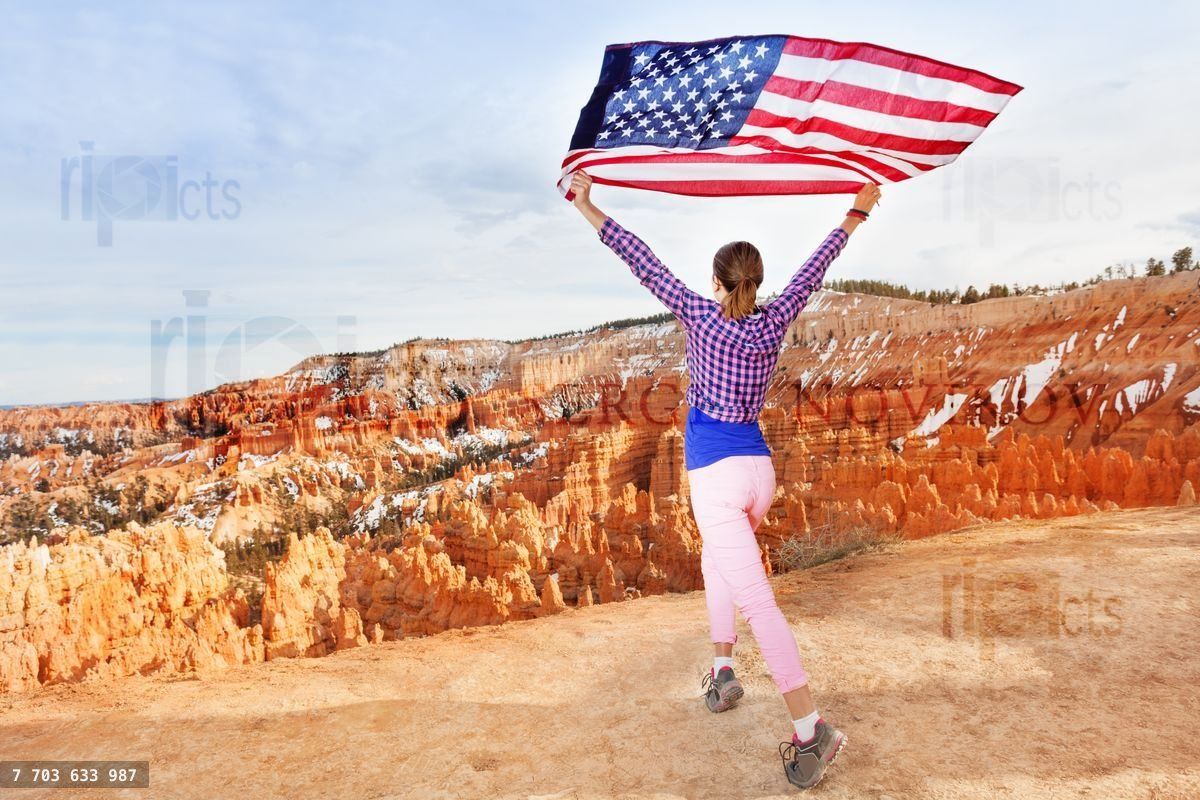 Woman holding US flag, Bryce Canyon National Park