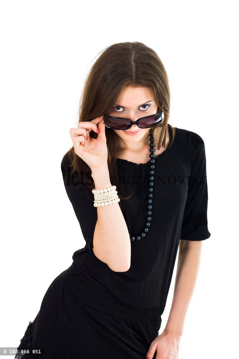 Woman looking out from sunglasses