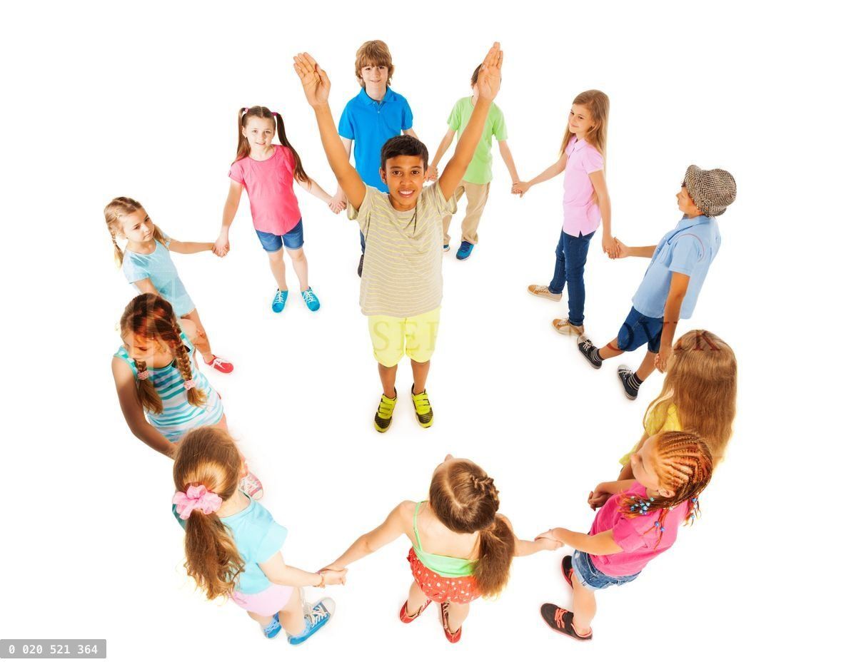 Asian boy in circle of other kids