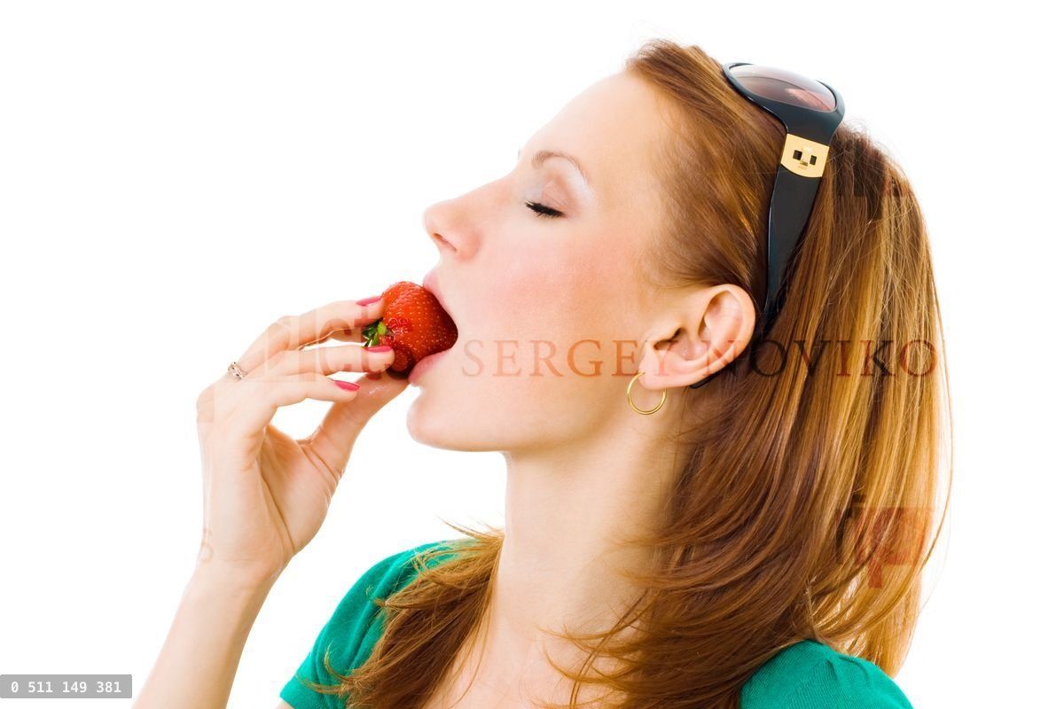 woman eating tasty strawberries