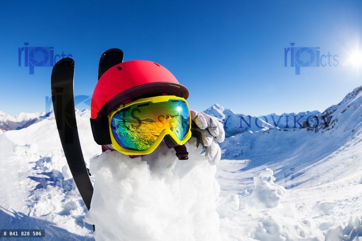 Funny snowman wearing safety helmet and mask