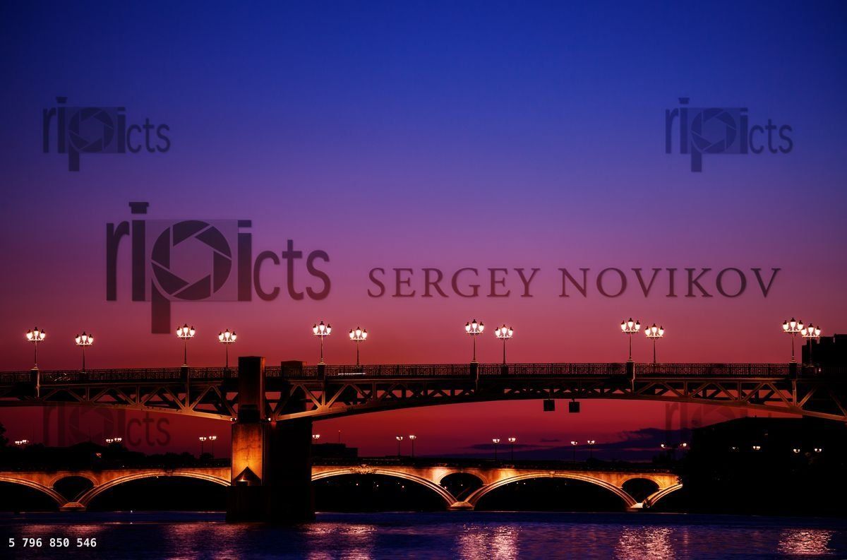 Garonne river embankment with illuminated bridges