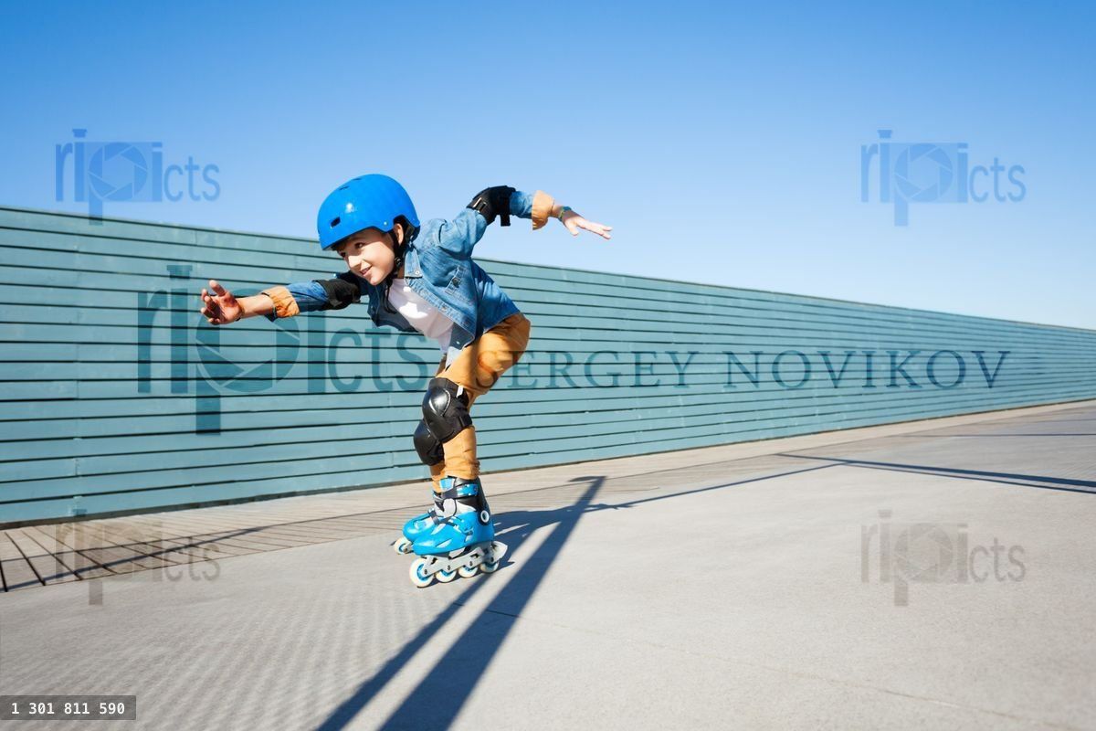 Young roller skater riding fast at rollerdrom