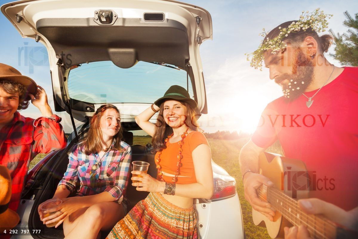 Young people having fun during a summer car trip