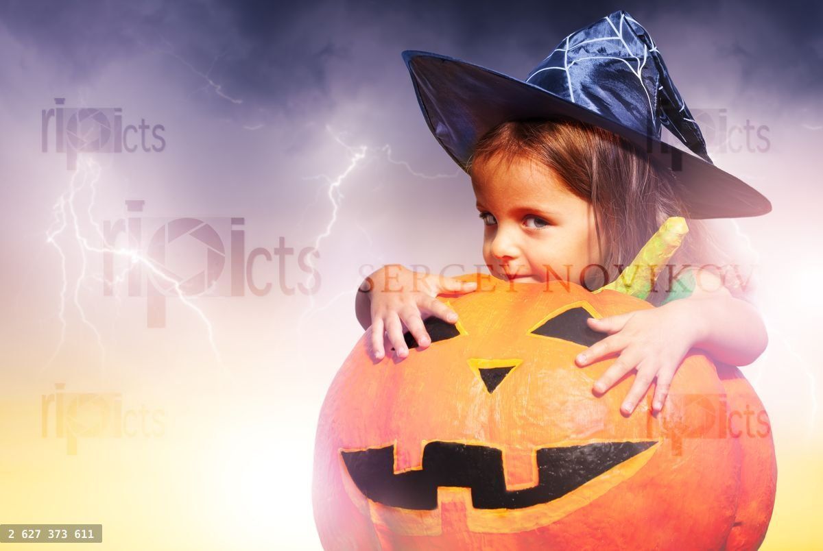 Girl expression in Halloween costume hug pumpkin