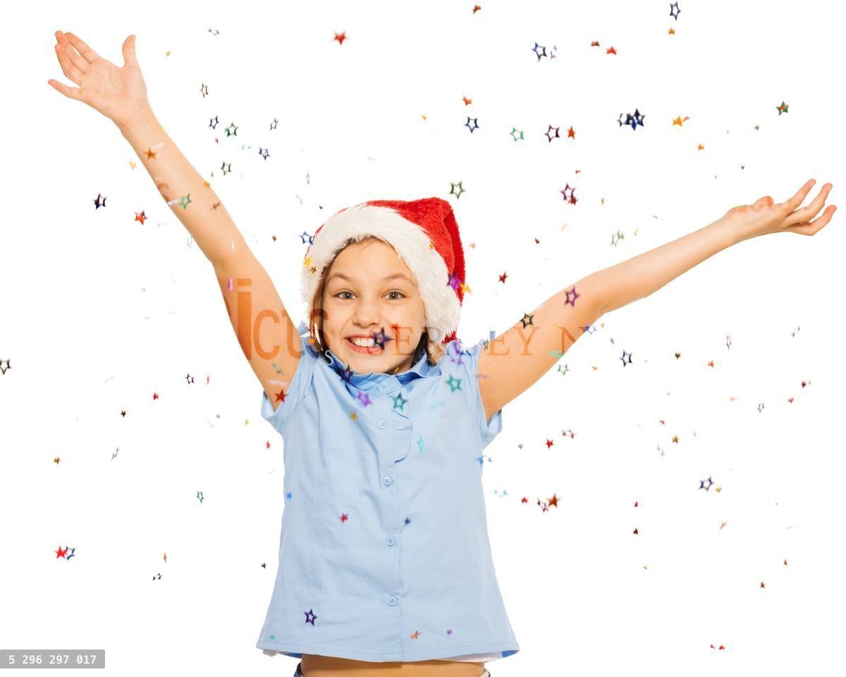 Happy beautiful girl in Santa cap throw confetti