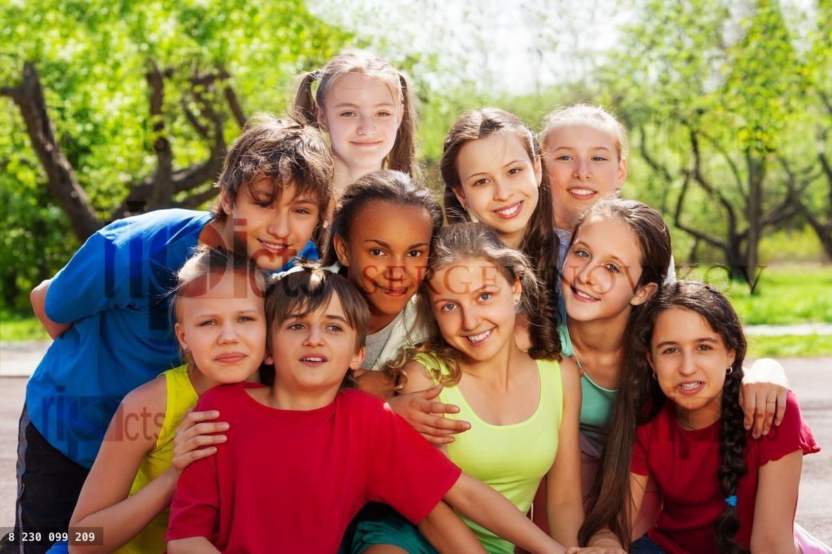 Close up view of teenagers sitting and hugging