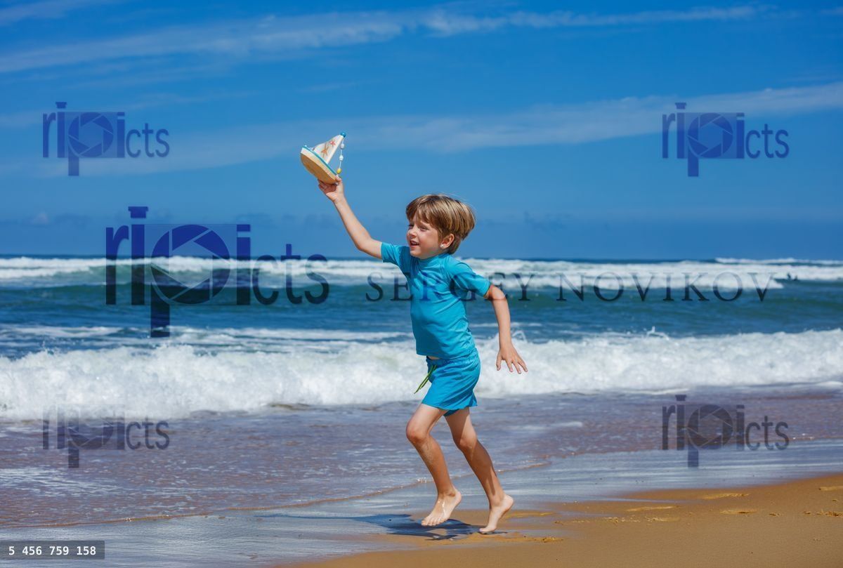 Young boy joyfully run on beach with toy sailboat at vacation