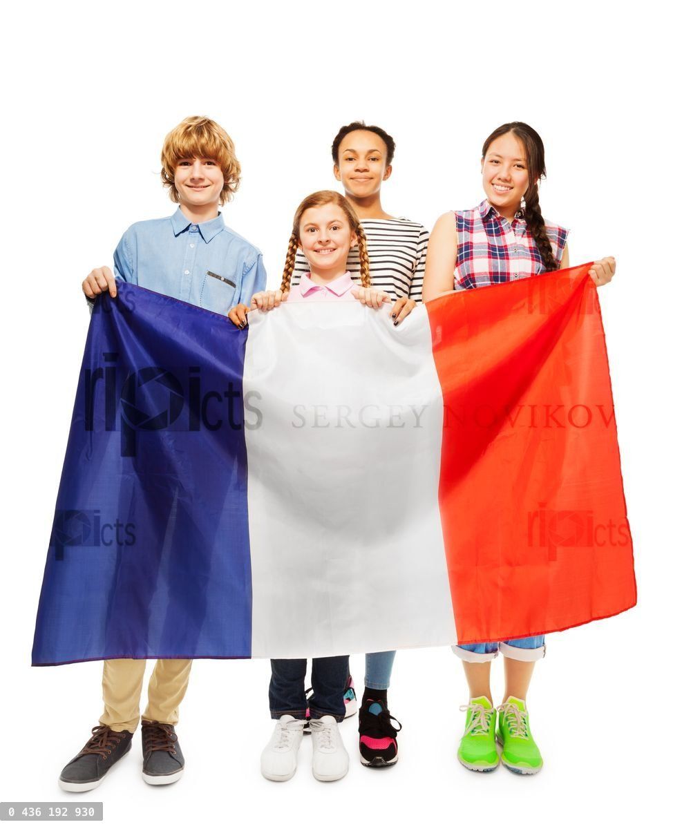 Four smiling multiethnic students from France