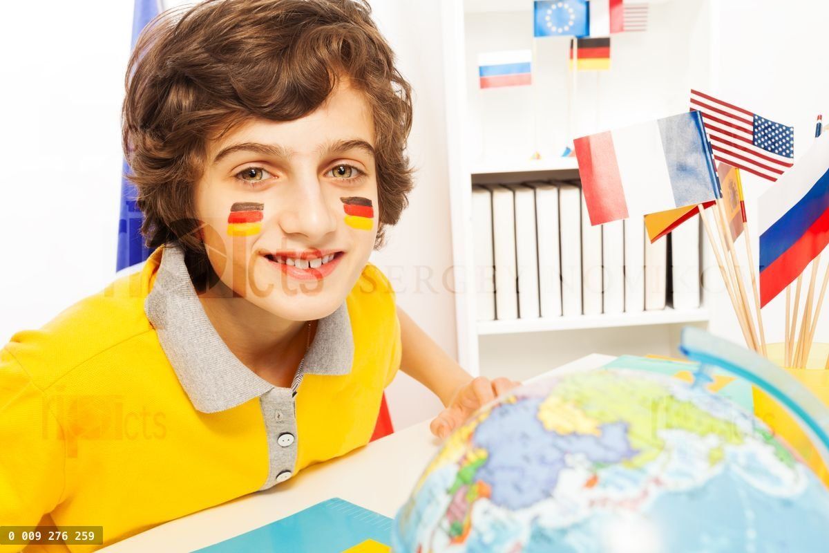 German schoolboy learning geography at the class