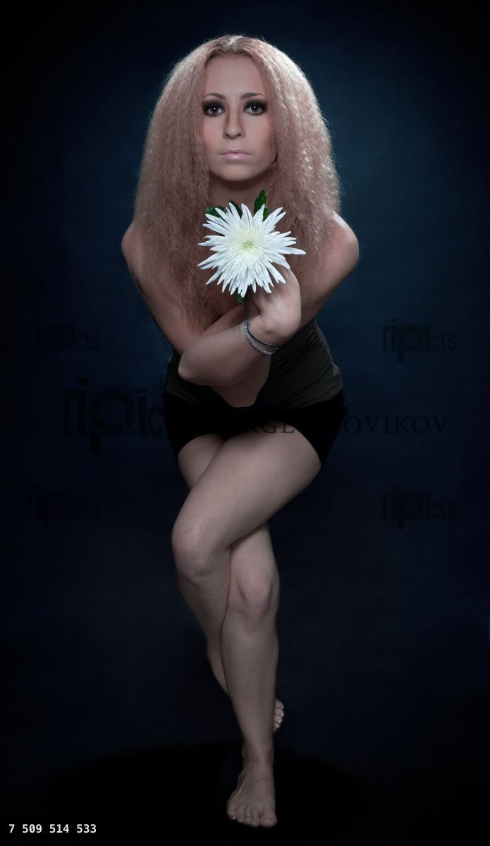 yoga pose with white flower