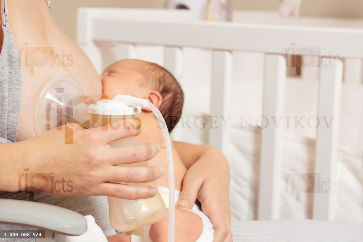 Breast pump close up and mother breastfeed baby in nursery