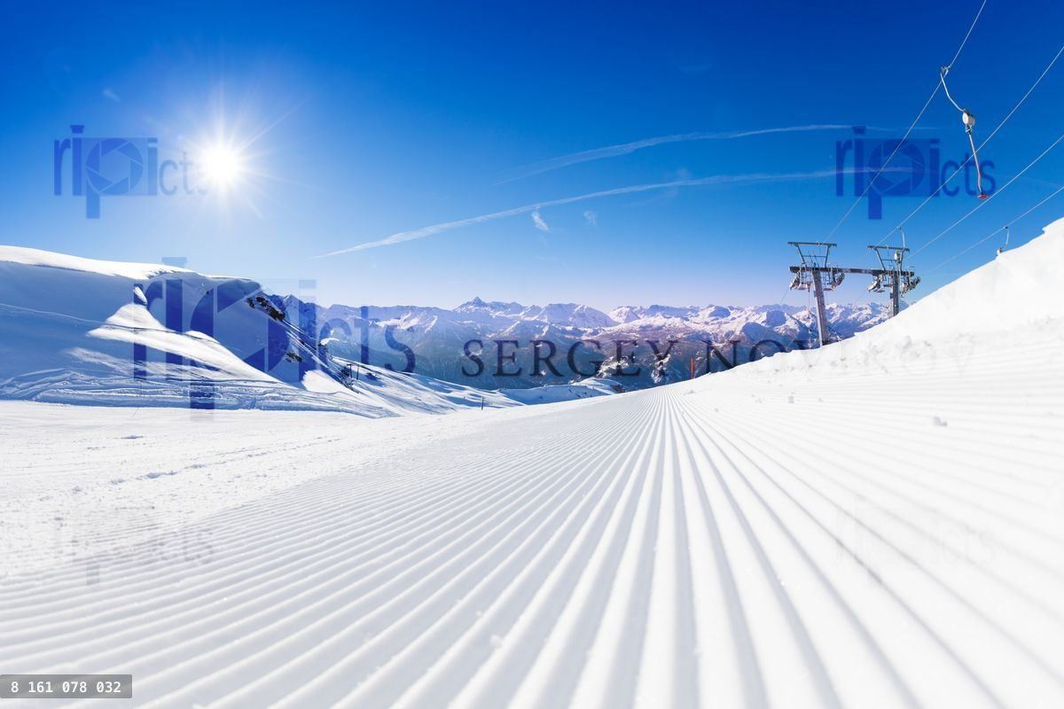 Fresh tracks of snowcat at the ski resort slopes