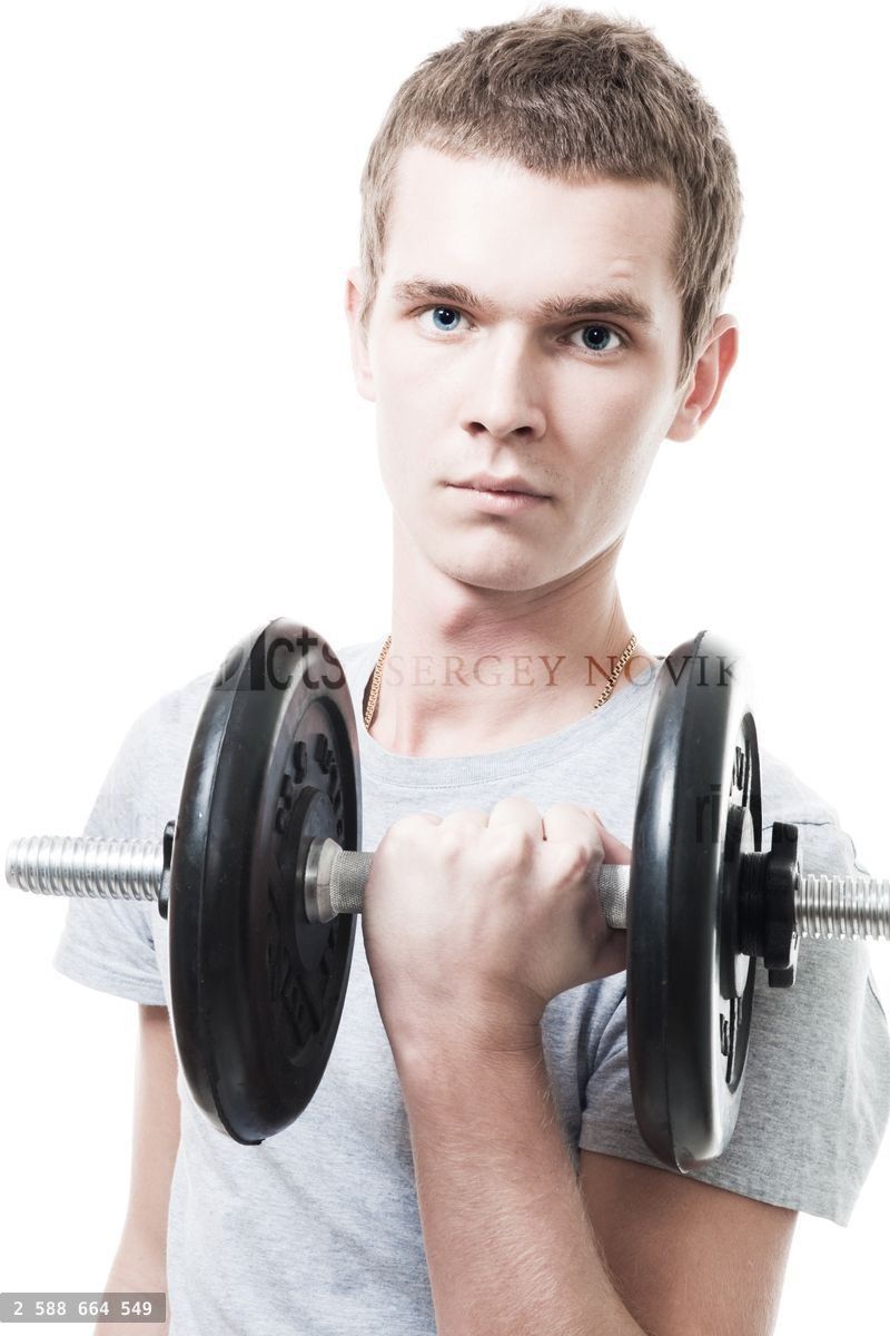 Young man lift weight in gym