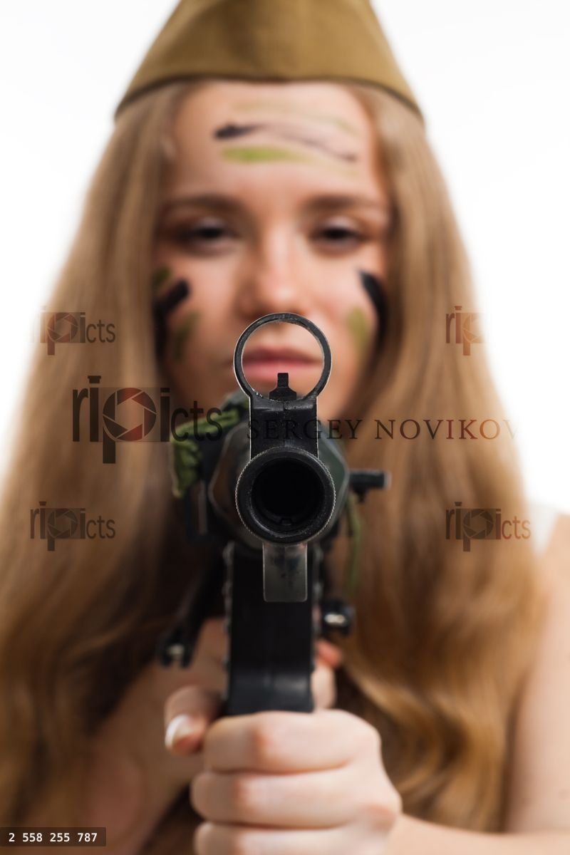 Woman look at camera through gun sight