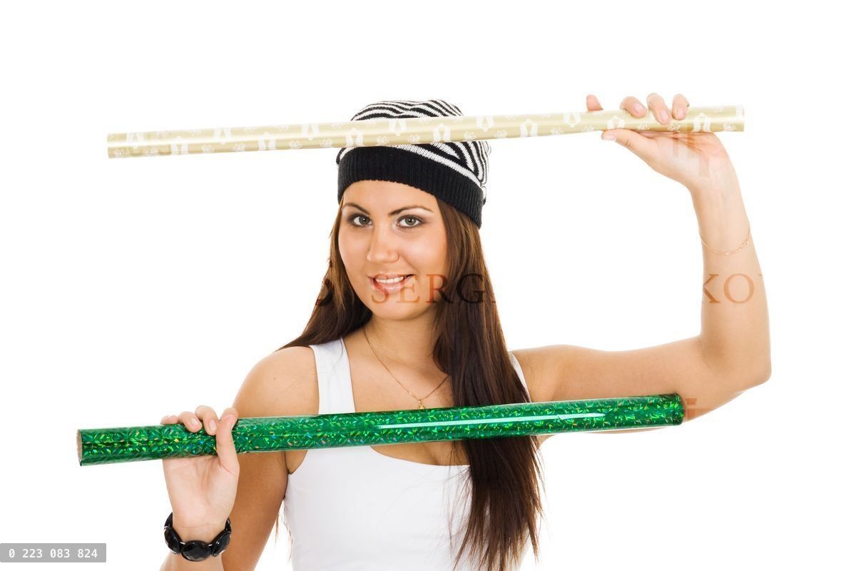 Woman holding two roll of wrapping paper