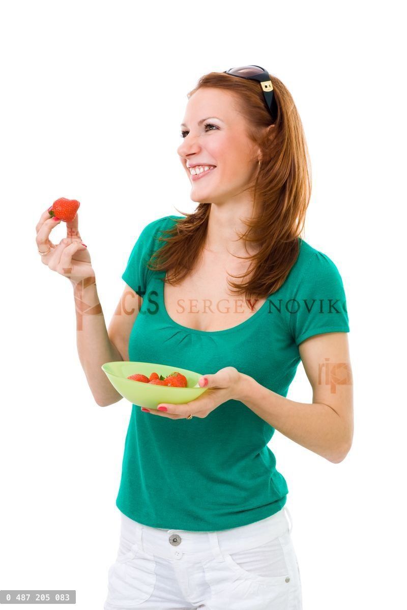 Woman eating strawberry