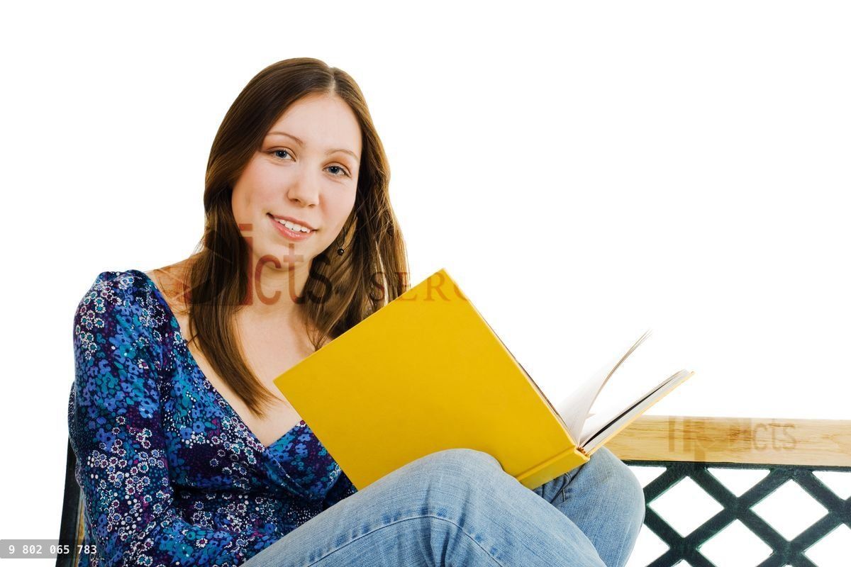 Woman sitting with yellow book
