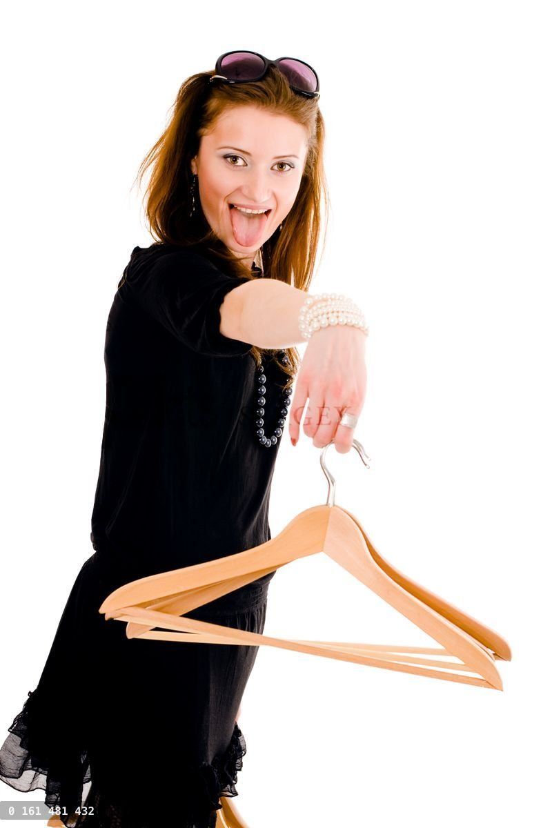 Woman holding hanger with tongue hang on