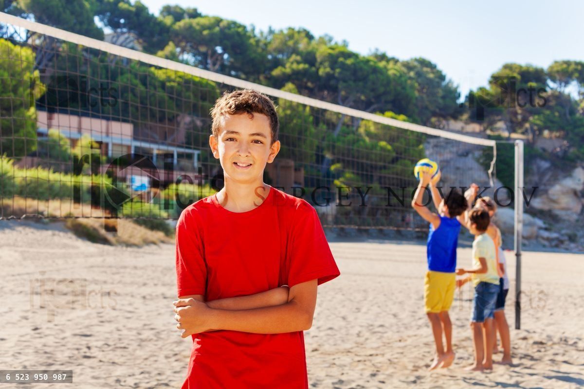 Young volleyball player on the court after game
