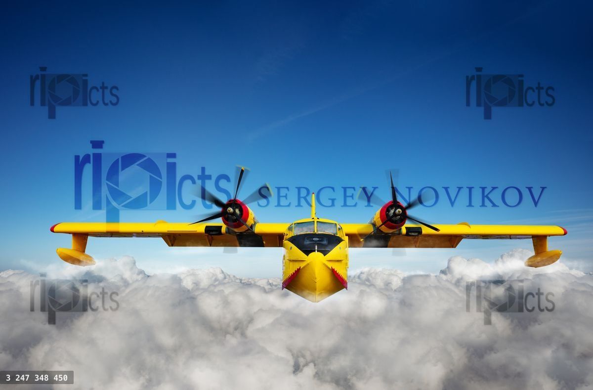 Yellow waterplane fly in clouds at high altitude