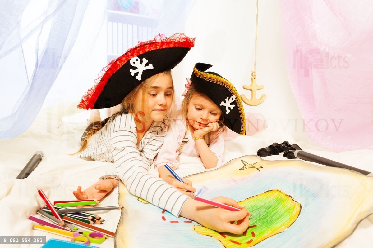 Young pirates drawing the treasure map
