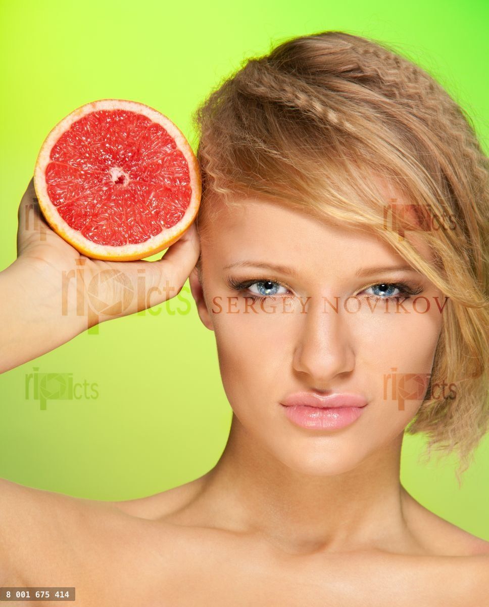Confident woman with fruit