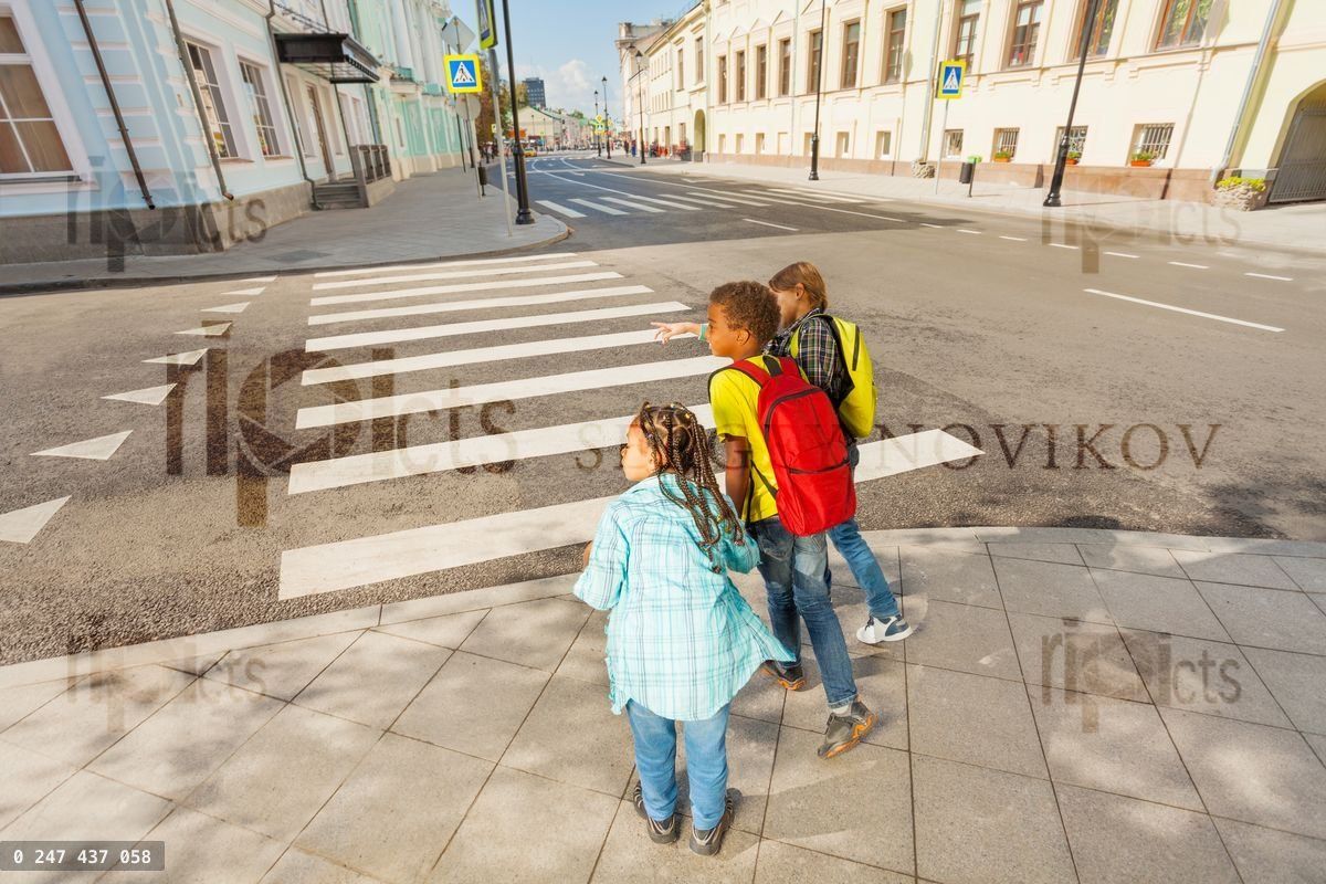 Careful children crossing street